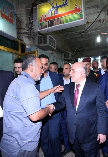 العبادي يجري جولة في أسواق ميسان 